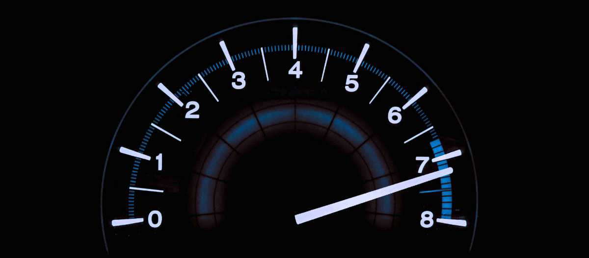 A speedometer in blue and white against a black background. The needle is pointed at the end of the range.