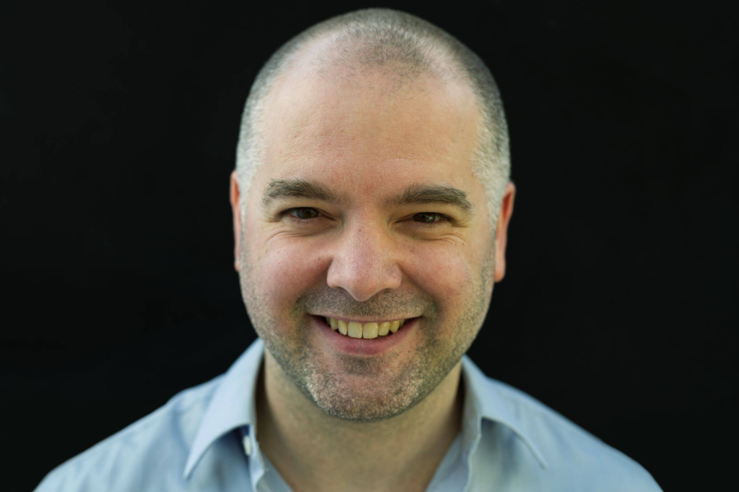 A portrait of Nicholas Warren, Apple Pro Specialist.